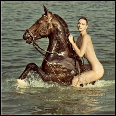 Naked girls on a horse  